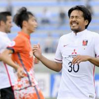Urawa’s Shinzo Koroki reacts after shot during Reds’ 2-0 lost to Jeju United in the first leg of their Asian Champions League round of 16 match on Wednesday in Jeju, South Korea. Urawa falls to Jeju in first leg of ACL last 16 clash
