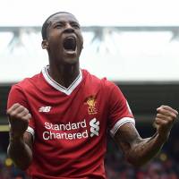 Liverpool’s Georginio Wijnaldum celebrates after scoring against Middlesbrough during their match on Sunday. Liverpool won 3-0 to secure a spot in next year’s Champions League. Liverpool, City deny Arsenal top-four finish
