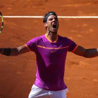 Rafael Nadal celebrates after his 6-2, 6-4 win over Novak Djokovic in the Madrid Open semifinals on Saturday. Nadal dominates Djokovic in Madrid Open semifinal