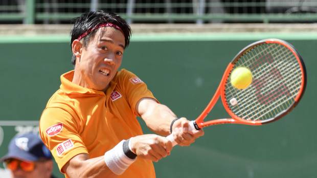 Kei Nishikori plays a shot from South Africa’s Kevin Anderson in their quarterfinal match at the Geneva Open on Thursday. Nishikori won 2-6, 6-4, 7-6 (8-6). Nishikori fights way into Geneva Open semis