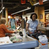 Customers line up at a grocery shop in Kiev Tuesday. A new and highly virulent outbreak of malicious data-scrambling software appears to be causing mass disruption across Europe, hitting Ukraine especially hard, with company and government officials reporting serious intrusions at the Ukrainian power grid, banks and government offices. Global cyberattack seen having links to WannaCry mayhem, indicating firms still not securing networks