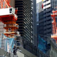 The construction site of a commercial building is seen in Tokyo in May. The Organization for Economic Cooperation and Development on Wednesday upgraded its forecast on Japan’s growth in gross domestic product for 2017 to 1.4 percent, up from 1.2 percent projected in March. OECD upgrades Japan's 2017 growth forecast to 1.4% on exports, stimulus