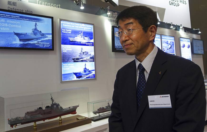 Shoji Sato, vice president and general manager at Mitsubishi Heavy Industries who is in charge of defense and space systems, at the maritime and air defense exhibit in Chiba Monday.