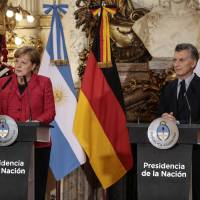 Angela Merkel, Germany’s chancellor, and Mauricio Macri, Argentina’s president,listen to a question during a joint press conference at the Presidential Palace (Casa Rosada) in Buenos Aires on Thursday. The German chancellor started a three-day trip to Argentina and Mexico on Thursday in a bid to shore up support for a Group of 20 agenda bent on supporting trade, protecting the climate and managing migration. Merkel in Argentina hits protectionist Trump, talks trade and climate change