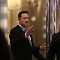Elon Musk, the co-founder and chief executive of Electric carmaker Tesla, attends a February ceremony in Dubai. Tesla founder and technology luminary said Wednesday he would quit President Donald Trump’s business advisory councils if Washington pulls out of the Paris climate accord. Musk’s move, announced on Twitter, could deepen the rift between the tech world and the Trump administration, which have been at odds over immigration and other issues. If Trump pulls out of Paris climate deal, Musk will quit his advisory panels