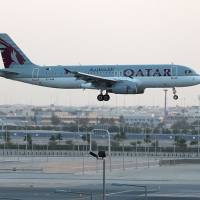 A Qatar Airways plane lands at the Hamad International Airport in the Qatari capital Doha on Monday. Qatar Airways called on the U.N.’s aviation body to declare a Gulf boycott against the carrier ‘illegal’ and a violation of a 1944 convention on international air transport. Qatar Airways calls on ICAO to declare Gulf boycott 'illegal blockade'