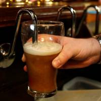 A barman pulls a pint of beer in a pub in Liverpool, England. A study released Wednesday showed “moderate” drinking was linked to brain damage. 'Moderate' drinking linked to brain damage: study