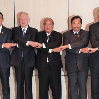 In show of solidarity (from left) Malaysian Minister of Defense Hishammuddin Hussein, U.S. Defense Secretary Jim Mattis, National Security Advisor of Myanmar U Thaung Tun, Philippine Under-Secretary for Defense Policy Gen. Ricardo David Jr. and Singapore Minister for Defense Ng Eng Hen join hands while posing for a photo after a meeting with the U.S. and the member states of the Association of Southeast Asian Nations (ASEAN) at the International Institute for Strategic Studies (IISS) Shangri-la Dialogue, an annual defense and security forum Sunday in Singapore. ASEAN states to use spy planes, drones as spread of Islamic State threat mounts