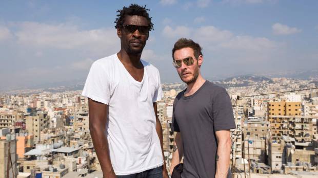 Robert “3D” Del Naja (right) and Grantley “Daddy G” Marshall of the British trip-hop band Massive Attack visit the Burj al-Barajneh camp for Palestinian refugees south of Beirut in July 2014. DJ's comment fuels speculation that elusive artist Banksy may be Massive Attack musician Robert Del Naja