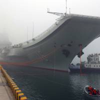 China’s first aircraft carrier, the Liaoning, is anchored in the northern port in Qingdao in February 2013. Chinese aircraft carrier departs for exercises, likely to visit Hong Kong for handover anniversary