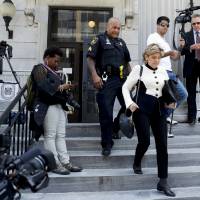 Attorney Gloria Allred walks down the steps of the Montgomery County Courthouse during jury deliberations in Bill Cosby’s sexual assault trial Thursday in Norristown, Pennsylvania. Judge orders deadlocked Cosby jury to keep trying to reach verdict after four days of deliberations