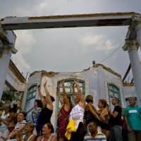 People dance during a concert in tribute to the Beatles in Havana Thursday. The concert marked the 50th anniversary of The Beatles’ album “Sgt. Pepper’s Lonely Hearts Club Band.” Cubans rock to once-censored Beatles at Havana tribute concert feting 'Sgt. Pepper's' 50th anniversary