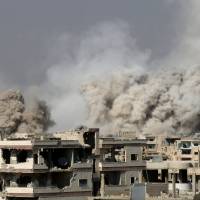 Smoke rises after shelling on a rebel-held area of Deraa, Syria, Sunday. Syrian troops pound Daraa in 'de-escalation' zone after rebel attack