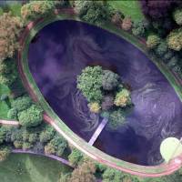 A 1997 aerial photo shows the island where Princess Diana is buried in the grounds of the Spencer family estate in Althorp, England, near Northampton north of London. Prince William, his wife, Kate, and Prince Harry will attend a private service Saturday at the late Princess Diana’s grave on what would have been her 56th birthday. Sons to mark Princess Diana's 56th birthday with graveside service
