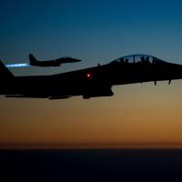 This file photo taken by the U.S. Air Force Central Command and released by the Defense Video & Imagery Distribution System (DVIDS) shows a pair of U.S. Air Force F-15E Strike Eagles flying over northern Iraq early in 2014 after conducting airstrikes in Syria. A U.S. warplane shot down an Iran-made drone operated by pro-regime forces in southern Syria early Tuesday, officials said, the second such incident in less than two weeks. U.S. fighter shoots down Iranian-made armed drone showing 'hostile intent' in southern Syria