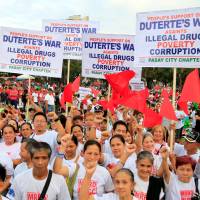 Supporters of Philippine President Rodrigo Duterte gather during a vigil backing the anti-drugs crackdown in Metro Manila in February. More blood but no victory as Philippines' Duterte-led drug war marks its first year