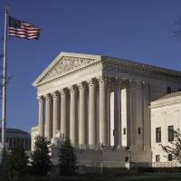 The Supreme Court Building is seen in Washington in April. In an era of deep partisan division, the Supreme Court could soon decide whether the drawing of electoral districts can be too political. A dispute over Wisconsin’s Republican-drawn boundaries for the state legislature offers Democrats some hope of cutting into GOP electoral majorities across the United States. Justices may weigh high-stakes fight over electoral maps, giving Democrats hope