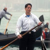 Alex Hai is seen as he rows a gondola in Venice in an undated file photo. Hai, a gondolier who made headlines a decade ago for being Venice’s first official female gondolier, has announced he is transgender. Alex Hai made the revelation Wednesday on Facebook and in a lengthy interview on Radiolab. Venice's first officially declared female gondolier announces he's transgender