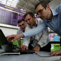 Technicians at Boryspil International Airport in Kiev work on a flight timetable for the airport’s site Tuesday. Ransomware the go-to hack for cybercriminals amid bitcoin rally, glut of stolen data