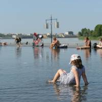 People cool off at the water mirror fountain on Monday in Bordeaux’s city center, southwestern France. Too hot to handle: Study shows Earth's killer heat worsens