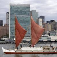 The voyaging canoe Hokulea passes the United Nations on New York’s East River on June 8, 2016, World Oceans Day. Traditional Hawaiian canoe returns after epic round-the-world voyage