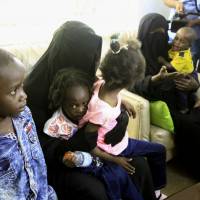 Sudanese children who, according to Sudanese authorities, are offspring of Islamic State (IS) fighters in Libya, arrive at Khartoum airport on Tuesday. Sudanese authorities had also previously repatriated a 4-month-old infant in February whose parents had died while fighting with IS jihadis in the Libyan city of Sirte. Sudan flies Islamic State fighters' kids from Libya to Khartoum