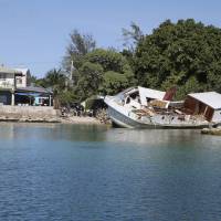 A boat lies wrecked and stuck on a seawall after it crashed into the back of Foreign Minister Tony de Brum’s house on Majuro Atoll in the Marshall Islands in 2015. To small island nations where the land juts just above the rising seas, the U.S. pulling out of the Paris global warming pact makes the future seem as fragile and built on hope as a sand castle. Top scientists say it was already likely that Earth’s temperatures and the world’s seas will keep rising to a point where some island states won’t survive through the end of the next century. With U.S. exit from Paris climate pact, small island states have only hope to cling to as seas encroach