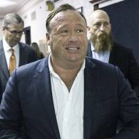 “Infowars” host Alex Jones arrives at the Travis County Courthouse in Austin, Texas, in April. Conspiracy theorist Jones hemmed and hawed Sunday when pressed repeatedly by Megyn Kelly to admit he was wrong to call the massacre at Newton, Connecticut, a hoax. 'Infowars' host Jones deflects questions when Kelly presses him on Sandy Hook denial