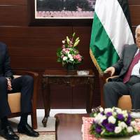 A handout picture provided by the Palestinian Authority’s press office (PPO) on Wednesday shows Palestinian leader Mahmud Abbas (right) and U.S. President Donald Trump’s senior advisor and son-in-law, Jared Kushner, in the West Bank city of Ramallah. Kushner kicks off first solo Mideast peace tour, meets Netanyahu, Abbas