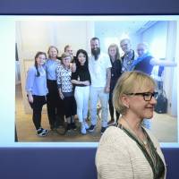 Swedish Foreign Minister, Margot Wallstrom, smiles in front of a picture of freed hostage Johan Gustafsson (center) and his family at Arlanda airport after his arrival in Sweden on Monday afternoon, during a press conference about the release of Gustafsson, who was kidnapped in Mali by al-Qaida in the Islamic Maghreb (AQIM) in 2011, at the government headquarters in Stockholm Monday. Sweden hostage freed in Mali after six years in captivity, fate of South African unknown