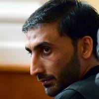 The accused head of an international smuggler group, Afghan Samsoor L., is pictured in a court room in Kecskemet, some 80 km from Hungarian capital Budapest, on Wednesday during a trial in connection with deaths of 71 migrants found in an abandoned truck in Austria in 2015. Hungary court tries accused Afghan mastermind of migrant trafficking ring after truck yields 71 corpses