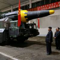 North Korean leader Kim Jong Un inspects the long-range strategic ballistic rocket Hwasong-12 (Mars-12) in this undated photo released by North Korea’s Korean Central News Agency (KCNA) on May 15. North Korea launches several land-to-ship cruise missiles off east coast: Seoul