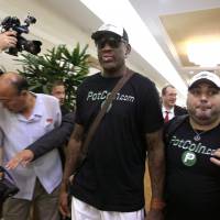 Former NBA basketball star Dennis Rodman arrives at Sunan International Airport in Pyongyang, North Korea on Tuesday. Rodman's return to North Korea brings with it speculation of Trump connection