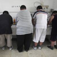 Obese patients wash their plates after lunch at the Aimin Fat Reduction Hospital in Tianjin, China, in 2008. The hospital uses a combination of diet, exercise and traditional Chinese acupuncture to treat rising obesity rates. Research released Monday found the obesity epidemic is getting worse in most parts of the world, according to data between 1980 and 2015. Obesity rising, affects 1 in 10 worldwide in nations rich and poor, especially kids