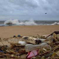 A plastic bottle lies among other debris washed ashore on the Indian Ocean beach in Uswetakeiyawa, north of Colombo, Sri Lanka, in 2015. Secretary-General Antonio Guterres on Monday opened the first-ever U.N. conference on oceans with a warning that the lifeblood of the planet is “under threat as never before,” with one recent study warning that discarded plastic garbage could outweigh fish by 2050 if nothing is done. Guterres opens U.N. conference on oceans, warns they are 'under threat as never before'