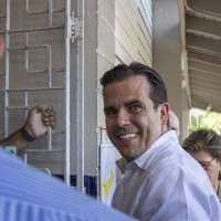 Ricardo Rossello, governor of Puerto Rico, smiles while arriving to cast a ballot during Puerto Rico’s status referendum plebiscite in San Juan, Puerto Rico, on Sunday. As the economic crisis continues, Puerto Ricans head to the polls in a chance to tell the U.S. Congress whether they want the island territory to join the Union as the 51st state of the United States. Amid low turnout, Puerto Ricans overwhelming vote to be 51st U.S. state in nonbinding referendum