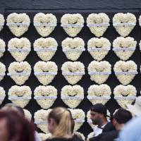 Wreaths honoring each life lost at Pulse nightclub are seen during a community gathering at the Pulse nightclub memorial site in Orlando, Florida, Monday. A gunman opened fire at the nightclub one year ago in the worst mass shooting in modern U.S. history, killing 49 people. Rainbows, angels mark year since IS-allied gunman killed 49 at Orlando gay nightclub