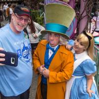 Jeff Reitz snaps a selfie on Thursday with The Mad Hatter and Alice after a teacup ride at the Mad Tea Party in Fantasyland at Disneyland in Anaheim, California. It was his 2,000th visit to the park. California man sets record by visiting Disneyland for 2,000 days in a row