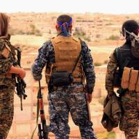Fighters from the Syrian Democratic Forces look toward the northern town of Tabqa, Syria, on April 30. In first, U.S. fighter jet shoots down regime warplane in Syria