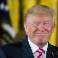 U.S. President Donald Trump smiles while announcing the Air Traffic Control Reform Initiative during a news conference in the East Room of the White House on Monday. White House tries to regroup, but Trump isn't helping