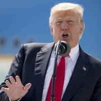 U.S. President Donald Trump speaks in front of Air Force One in Milwaukee on Tuesday. Trump financial disclosures show Mar-a-Lago business boom