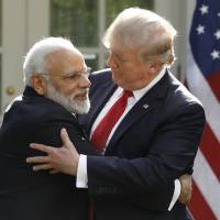 Indian Prime Minister Narendra Modi hugs U.S. President Donald Trump as they give joint statements in the Rose Garden of the White House in Washington on Monday. Trump and Modi exchange hugs, herald stronger U.S.-India ties