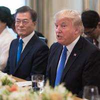 U.S. President Donald Trump speaks as Moon Jae-in, South Korea’s president, listens prior to dinner in the State Dinning Room at the White House in Washington on Thursday. Trump to take up North Korea threat, trade in talks with Moon