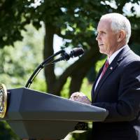 U.S. Vice President Mike Pence speaks during an announcement in the Rose Garden of the White House in Washington on Thursday. President Donald Trump announced the U.S. would withdraw from the Paris climate pact and that he will seek to renegotiate the international agreement in a way that treats American workers better. Trump climate pact exit seen tilting 'America First' toward 'America Alone'