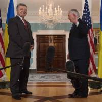 U.S. Secretary of State Rex Tillerson waves off a question from the press during a meeting with Ukrainian President Petro Poroshenko at the State Department in Washington Tuesday. Trump meets Poroshenko, says he wants peace in Ukraine but skips backing of Minsk accord