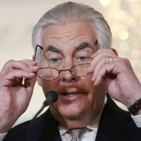 U.S. Secretary of State Rex Tillerson prepares to read a statement about Qatar at the State Department in Washington on Friday. Trump scolds Qatar as Tillerson seeks to ease crisis
