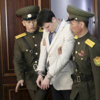 American student Otto Warmbier is escorted at the Supreme Court in Pyongyang on March 16, 2016. North Korea 'brutalized' student returned to U.S. in coma, says father