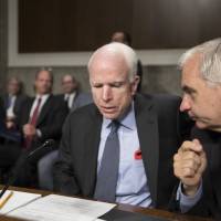 Senate Armed Services Committee Chairman John McCain (left)confers with Sen. Jack Reed, the ranking member, at the start of a hearing at the Capitol in Washington Tuesday. McCain said Tuesday that North Korea “murdered” Otto Warmbier, the 22-year-old American college student who died just days after North Korea released him from detention in a coma. He had arrived in Ohio on June 13 after being held for more than 17 months. Ohio coroner performs external exam of ex-North Korea prisoner Otto Warmbier before funeral service at school