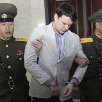 American college student Otto Warmbier is escorted at the Supreme Court in Pyongyang on March 16, 2016. North Korean detainee Otto Warmbier, in coma for over a year, is evacuated to U.S.