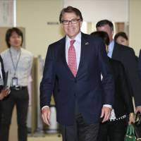 U.S. Energy Secretary Rick Perry arrives for a meeting with Minister of Economy, Trade and Industry Hiroshige Seko at the ministry in Tokyo on Monday. Perry reassures Japan on U.S. commitment to clean energy despite Paris accord exit